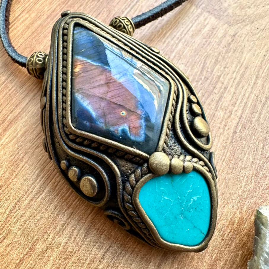 Labradorite and Turquoise Pendant Necklace on a wooden surface
