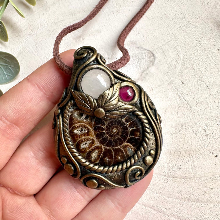 Spiritual jewelry necklace handcrafted with healing crystals for witches, healers, and fantasy jewelry lovers.