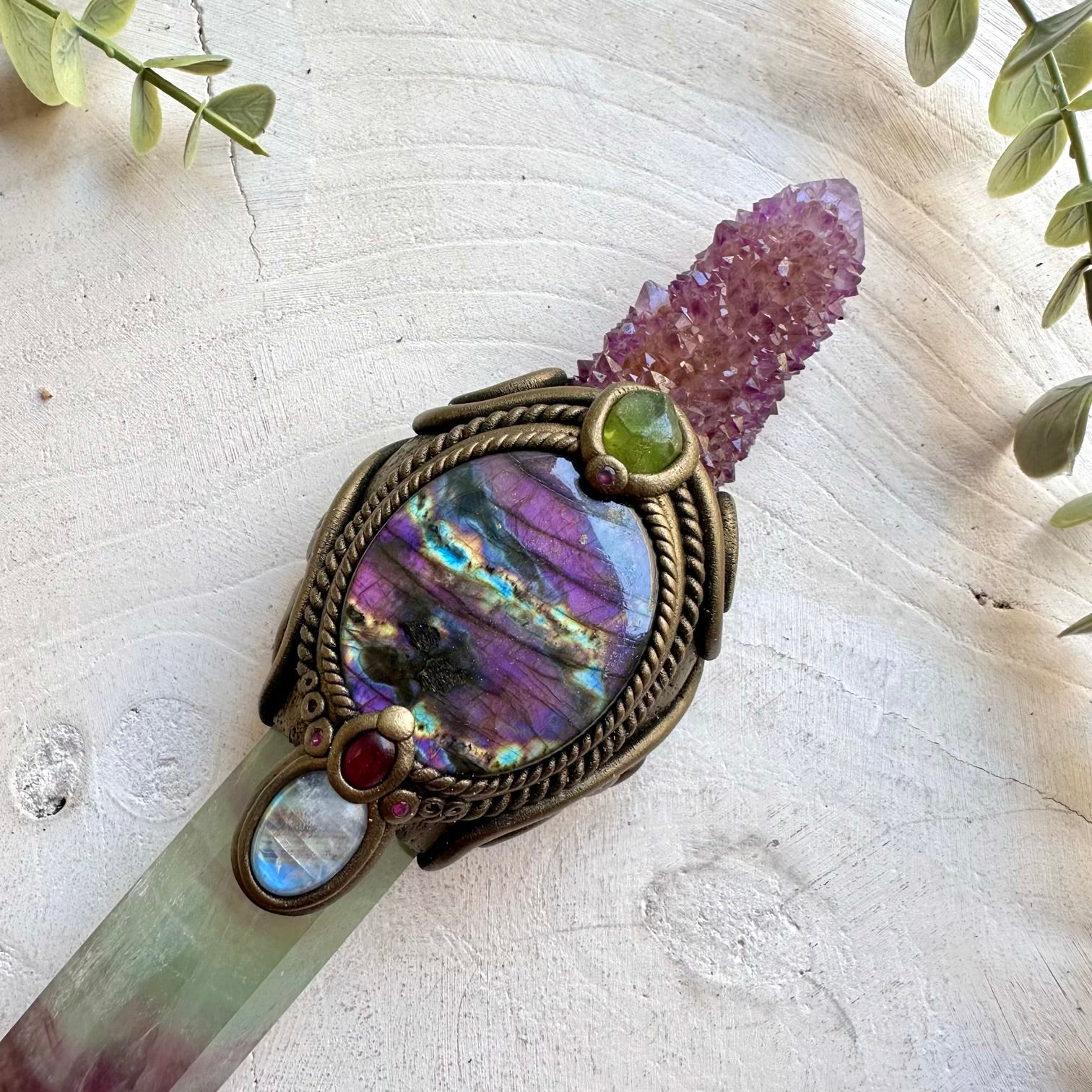 Beautiful gemstone wand featuring Rainbow Fluorite and carefully selected natural crystals.