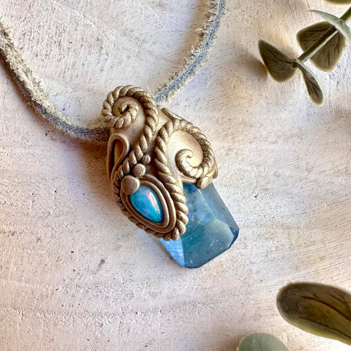 Handmade pendant necklace featuring Aqua Aura Quartz and Blue Ethiopian Opal gemstones.