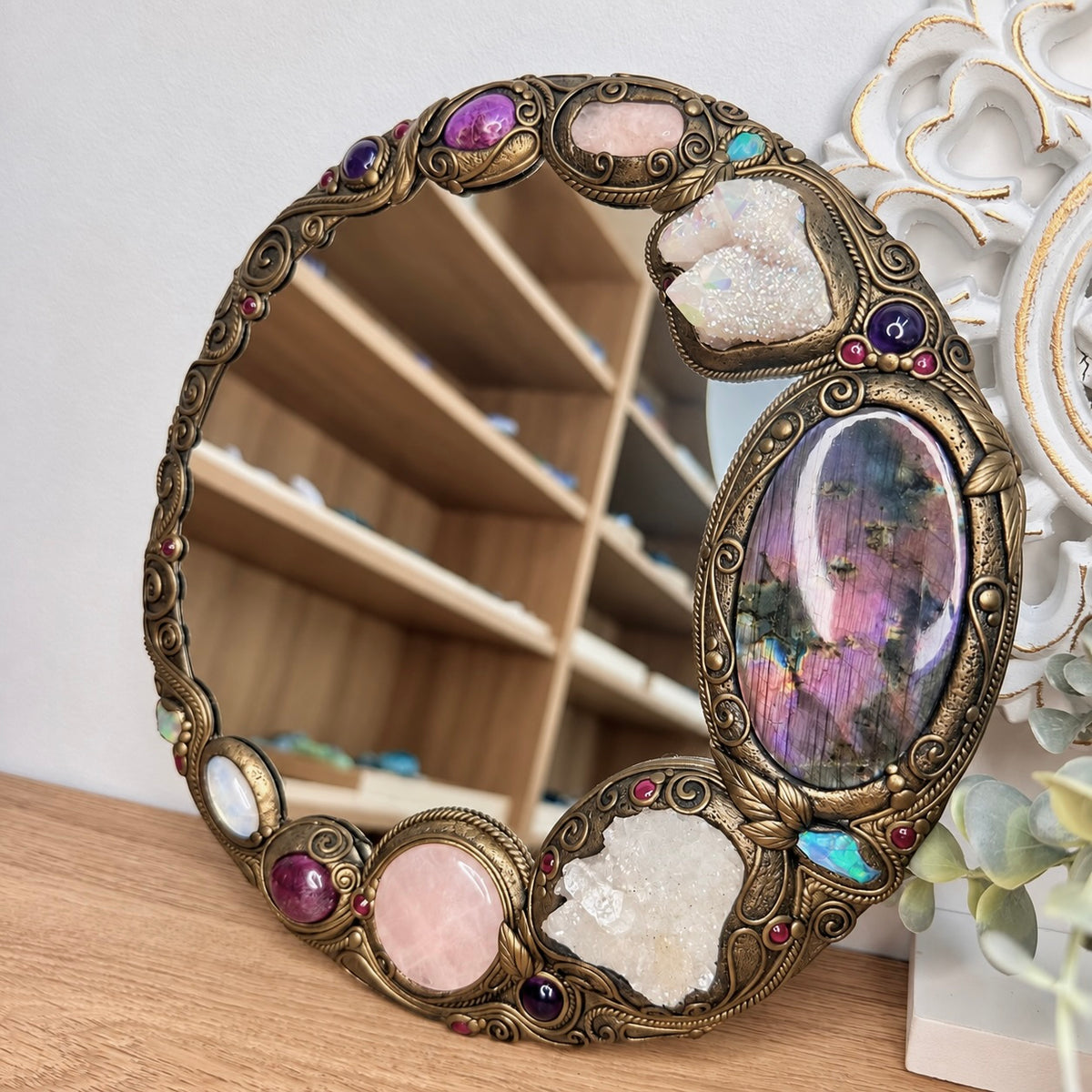 Handmade crystal mirror with Purple Labradorite, Apophyllite, Rose Quartz and Rainbow Moonstone for spiritual home decor.