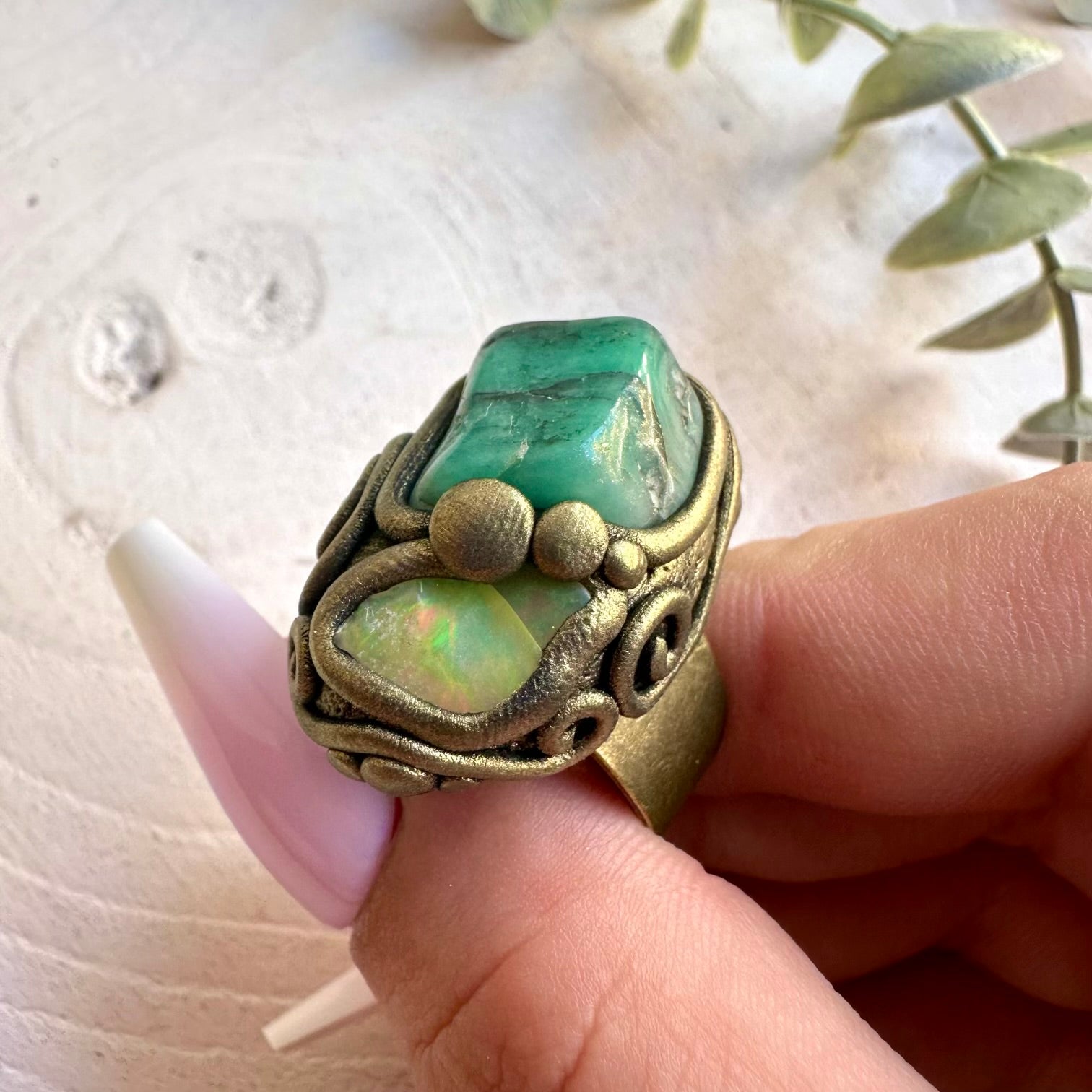 One of a kind Emerald ring with colorful Raw Ethiopian Opal accents.