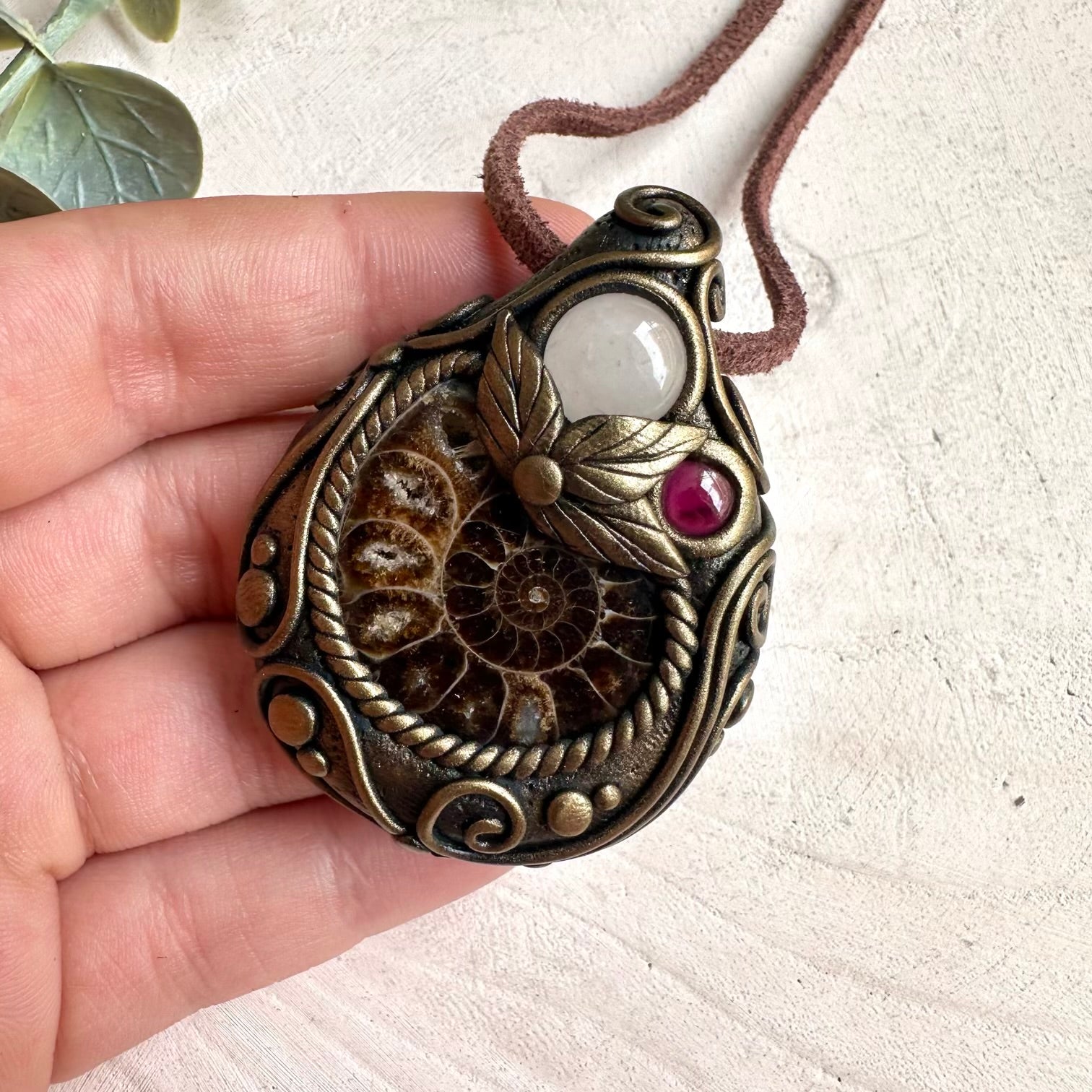 Ammonite, Clear Quartz, and Rhodolite Garnet healing crystal necklace with metaphysical gemstone