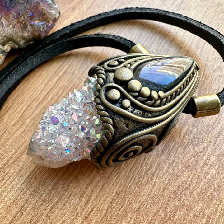 Spiritual Necklace with angel aura spirit quartz and labradorite pendant on a wooden surface