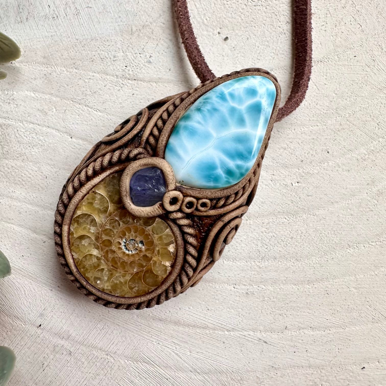 Spiritual jewelry combining larimar ammonite and tanzanite