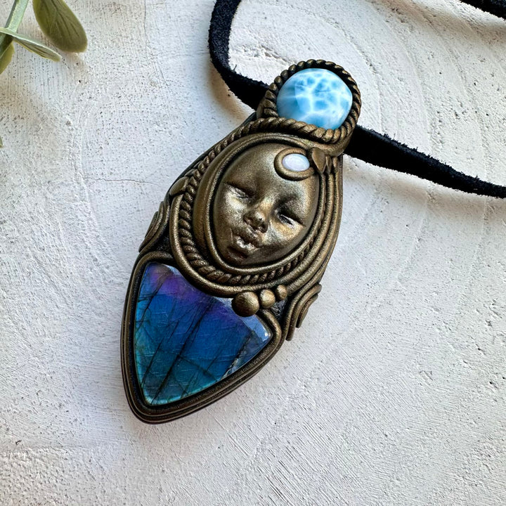 Labradorite paired with larimar and opal in a necklace