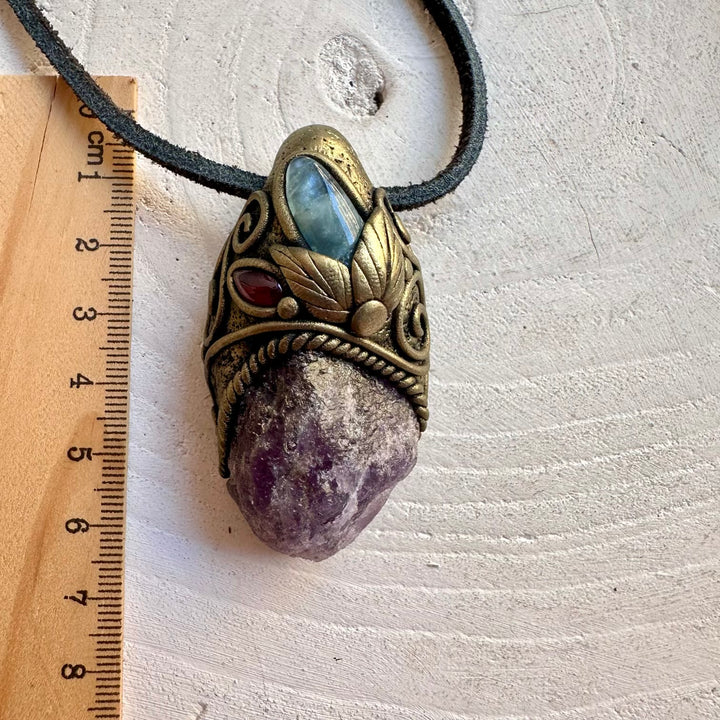 Handmade pendant necklace featuring Raw Scapolite, Aquamarine and Rhodolite Garnet.