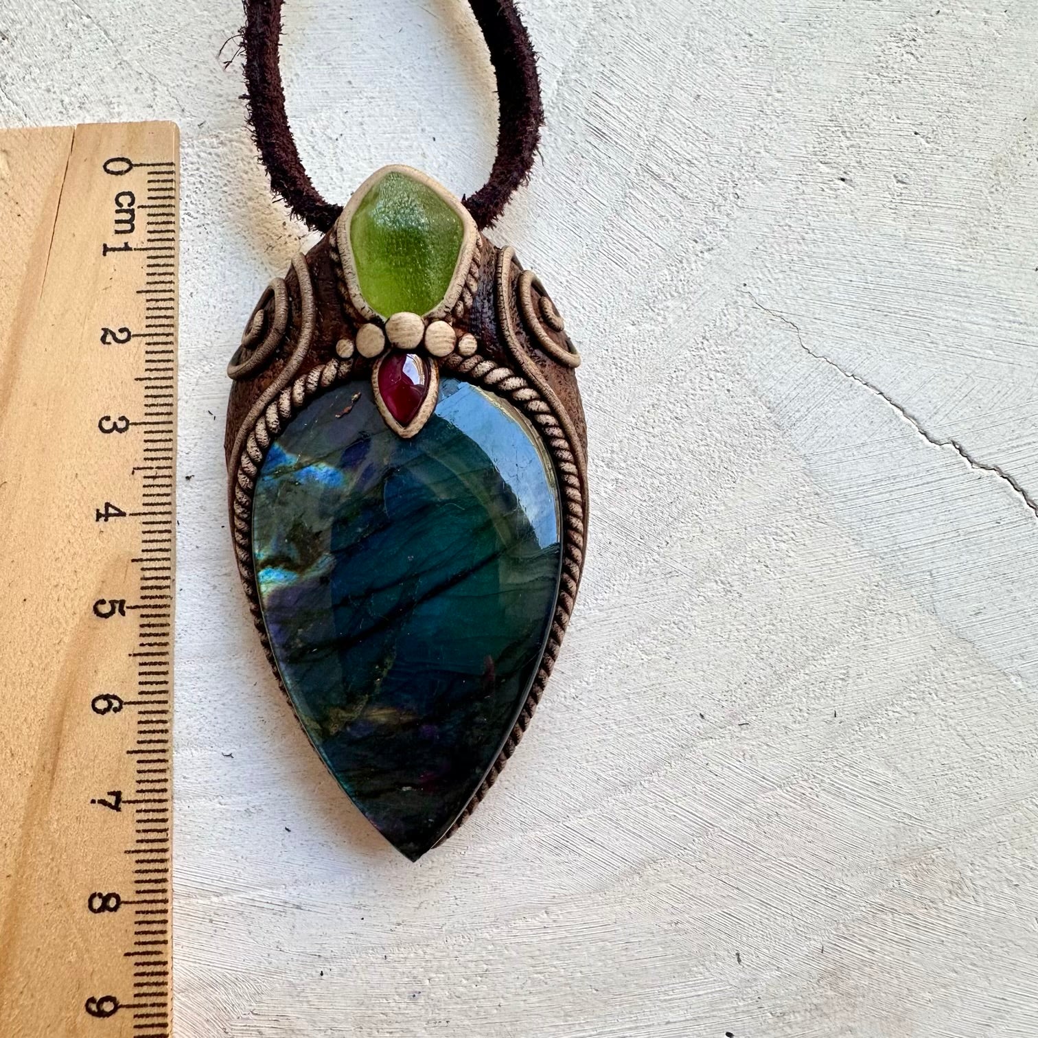 Handmade crystal pendant featuring natural gemstones