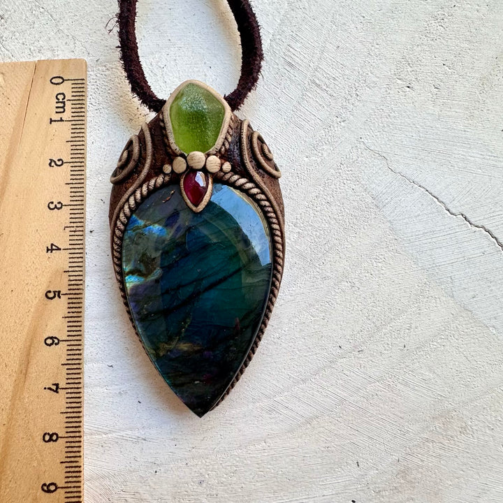 Handmade crystal pendant featuring natural gemstones