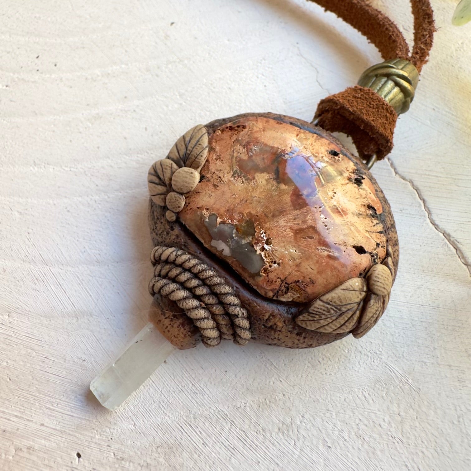 Close up of petrified wood and aquamarine necklace