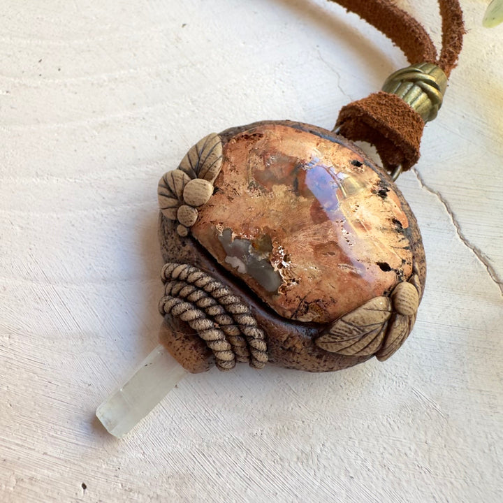 Close up of petrified wood and aquamarine necklace