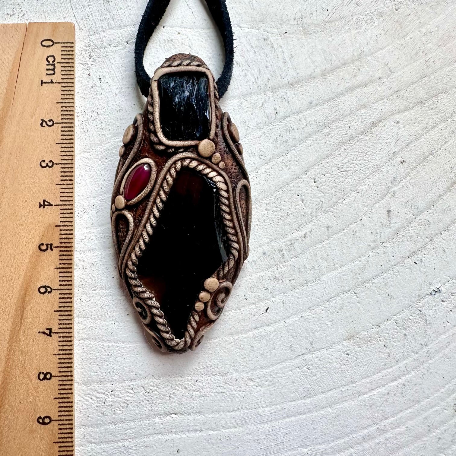 Natural gemstone pendant featuring Black Obsidian for grounding with Vivianite and Garnet details.