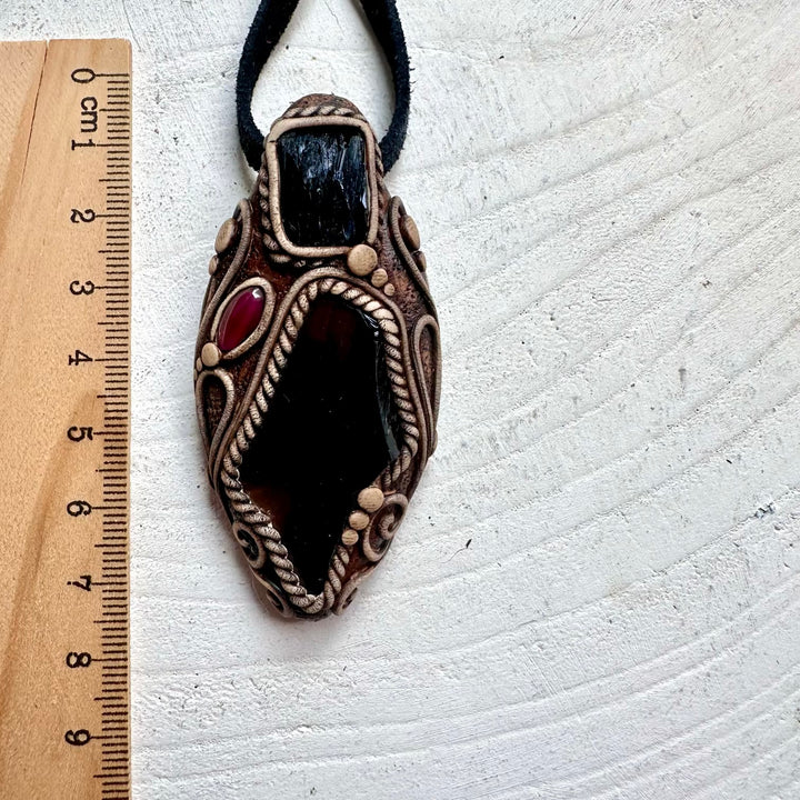 Natural gemstone pendant featuring Black Obsidian for grounding with Vivianite and Garnet details.