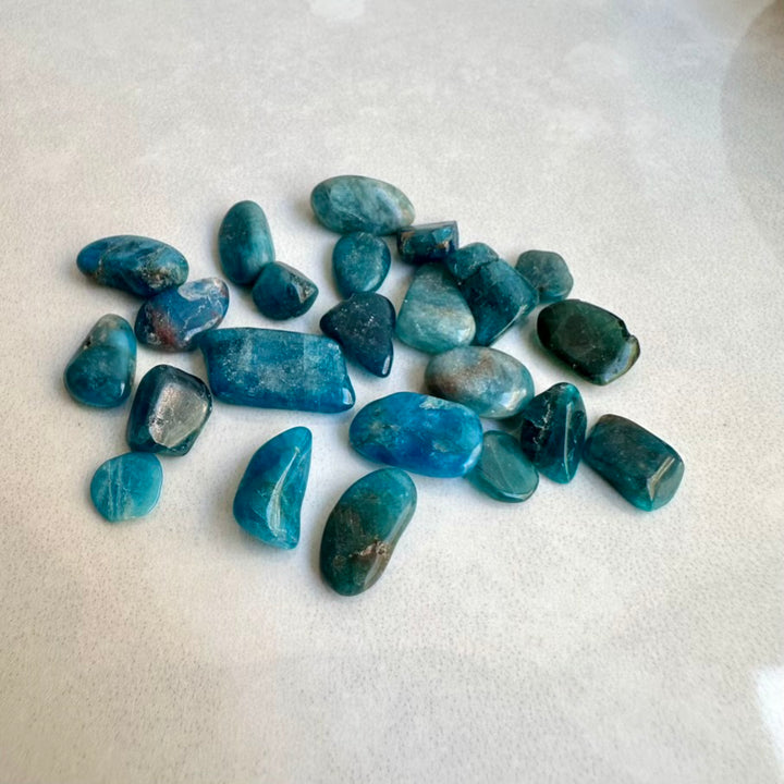 Blue stones on a white surface