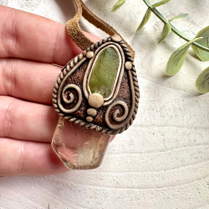 Metaphysical crystal jewelry featuring Citrine and Peridot for prosperity and renewal.