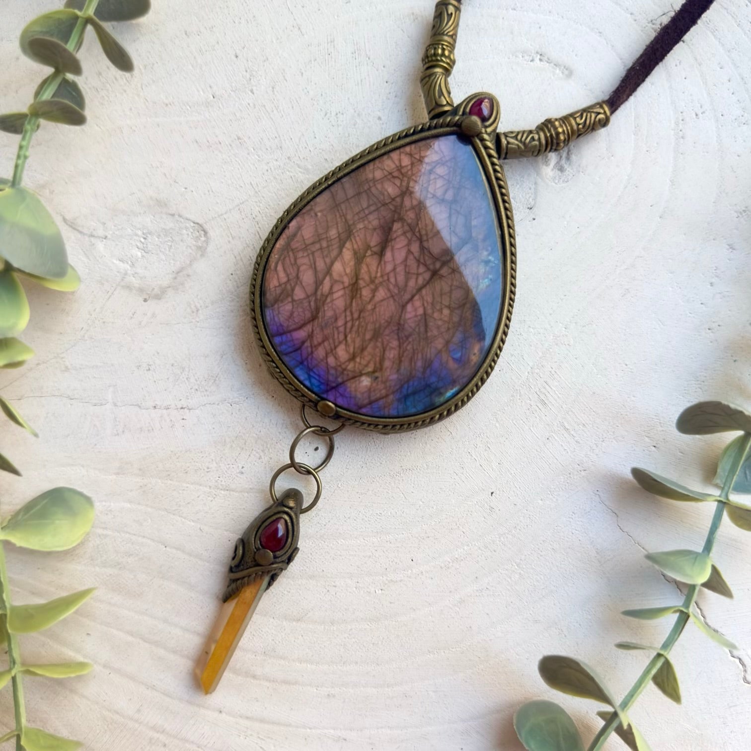 Large gemstone pendant necklace with vibrant sunset colors