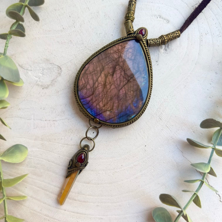 Large gemstone pendant necklace with vibrant sunset colors