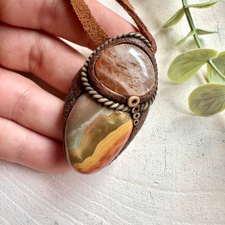 Artisan crystal pendant combining colorful Polychrome Jasper with natural Hematite Quartz.