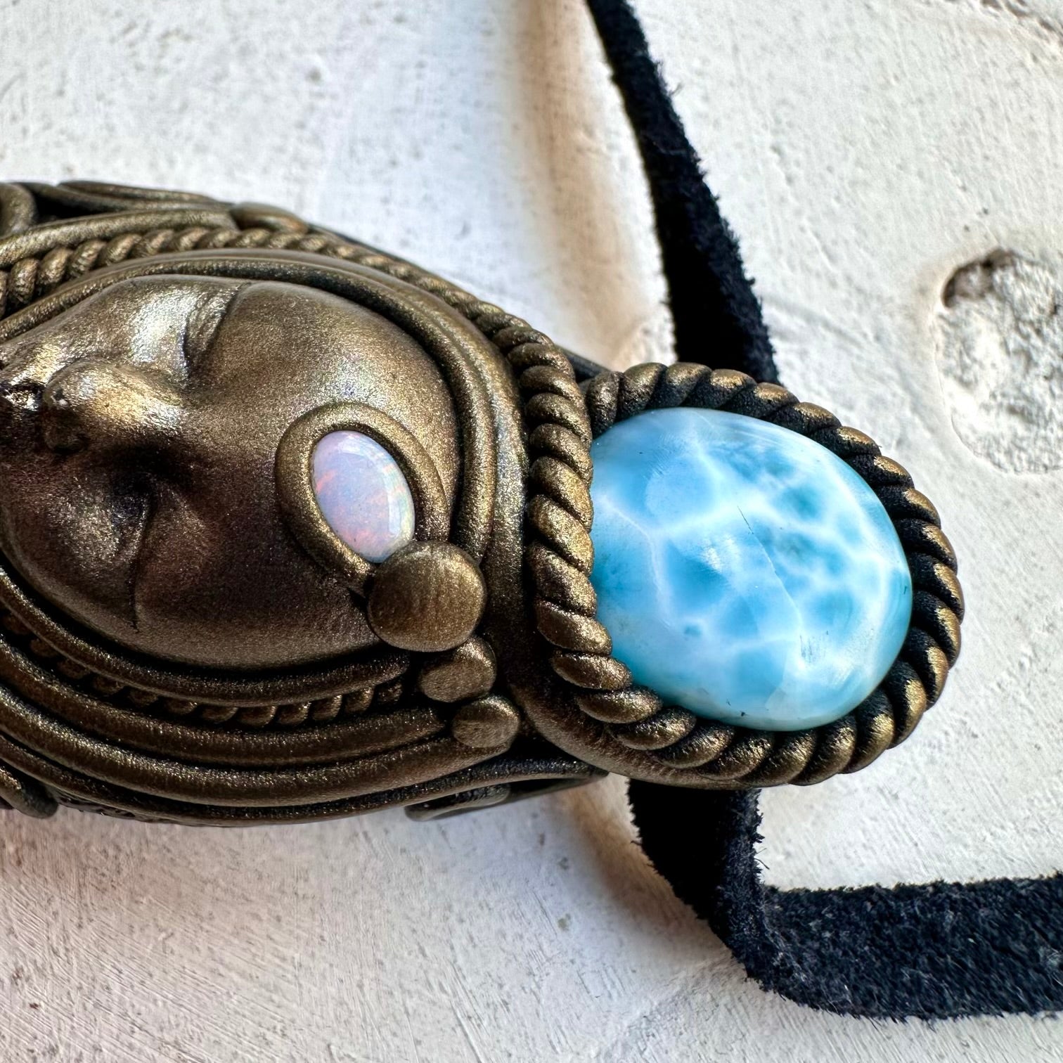 Labradorite paired with larimar and opal in a necklace