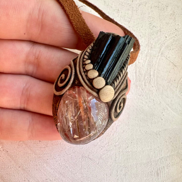 Metaphysical necklace featuring grounding and energizing stones