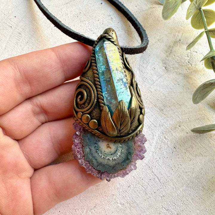 Handmade Amethyst Stalactite and Aqua Aura Quartz pendant necklace featuring unique natural crystal formations and luminous color. A one of a kind spiritual jewelry piece combining purple Amethyst with shimmering blue Aura Quartz, inspired by intuition, calm, clarity and spiritual connection.