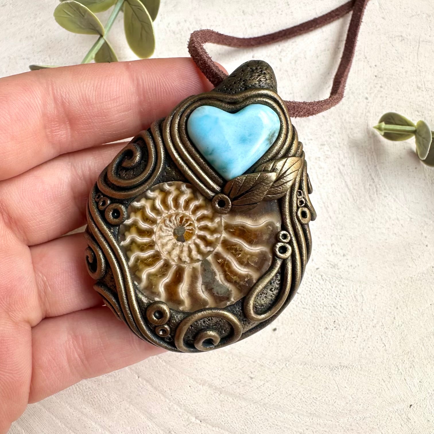 Mystical heart crystal necklace with larimar gemstone and ammonite fossil centerpiece