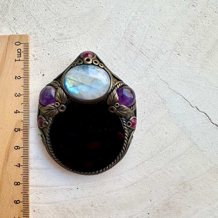 Healing crystal jewelry combining moon, fire and grounding energies