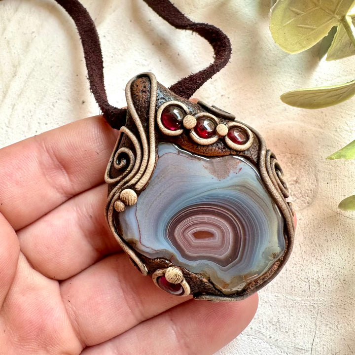 Spiritual crystal jewelry with Botswana Agate and Garnet for grounding and emotional balance.