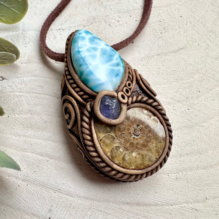 Larimar paired with ammonite and tanzanite in a necklace