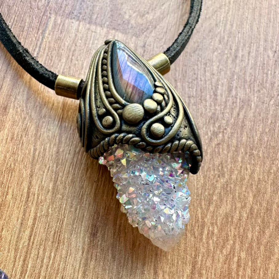 Crystal Necklace and crystal-like element on a wooden surface