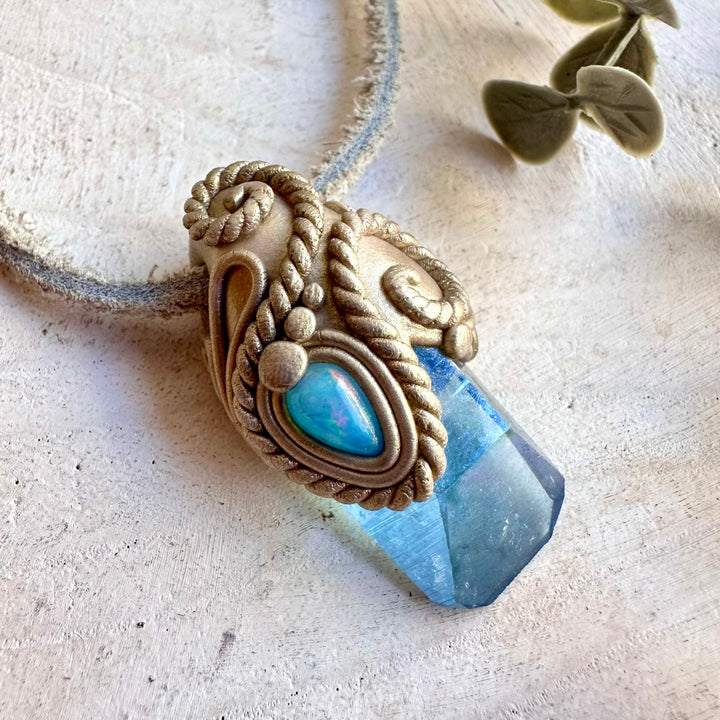 Natural gemstone pendant with Aqua Aura Quartz and vibrant blue Ethiopian Opal accents.