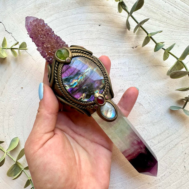 Raw healing crystal wand with Rainbow Fluorite, Deep Purple Spirit Quartz, Purple Labradorite, Rainbow Moonstone, Raw Peridot, Rhodolite Garnet and Ruby.