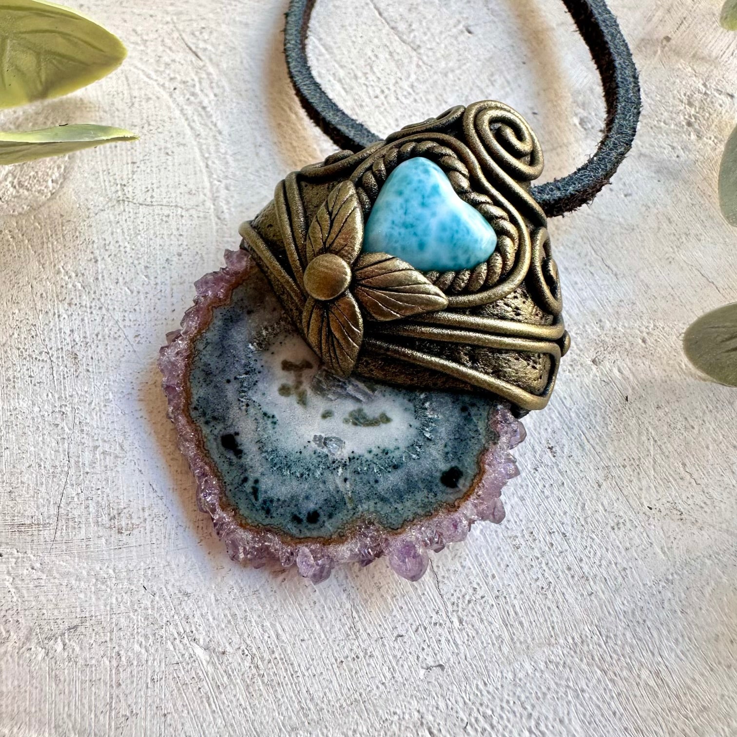 Artisan pendant showcasing a natural Amethyst Stalactite with a heart-shaped Larimar gemstone.