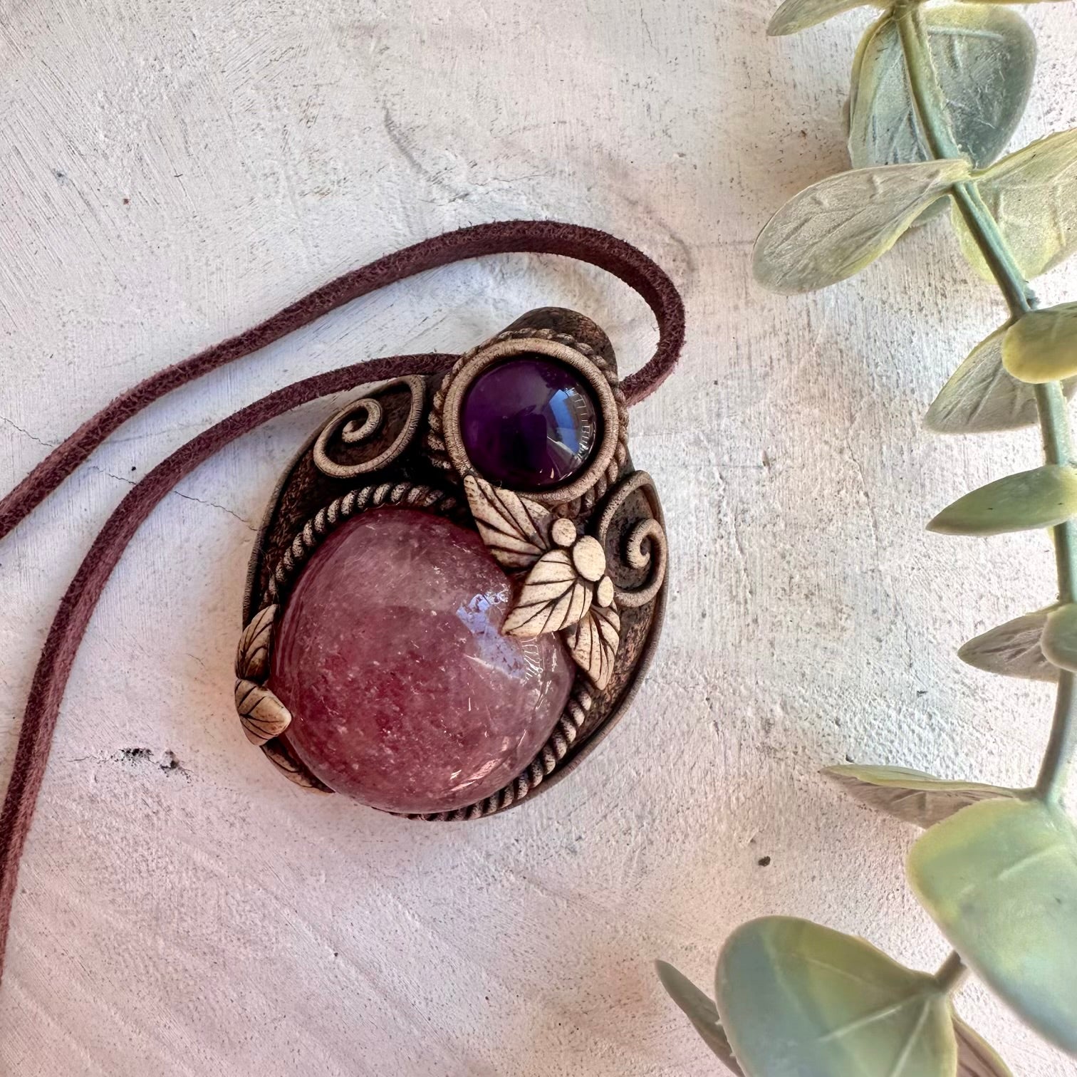 Close up of Strawberry Quartz and Amethyst pendant necklace