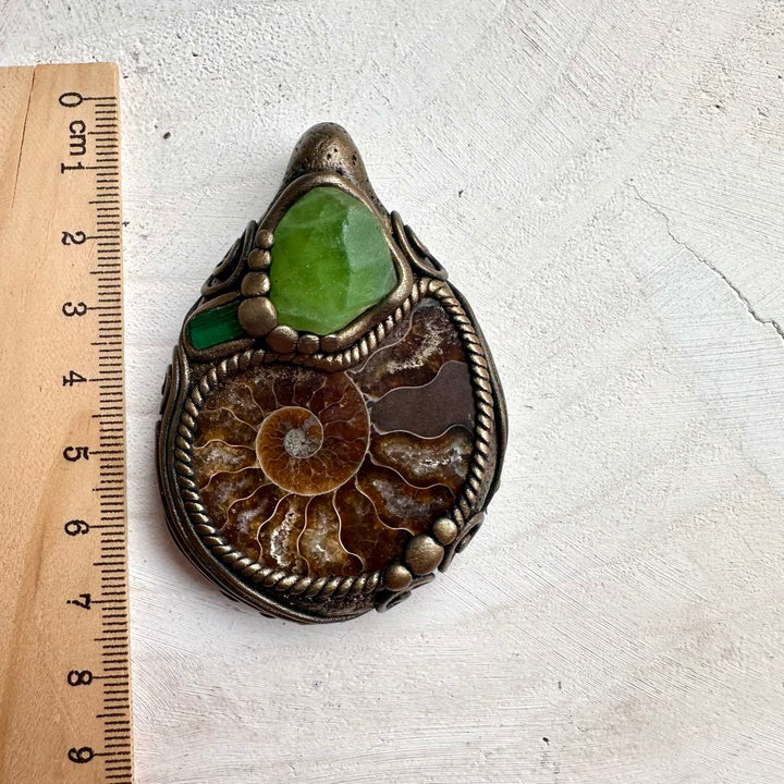 Mystical ammonite healing necklace with green tourmaline and peridot crystal accents
