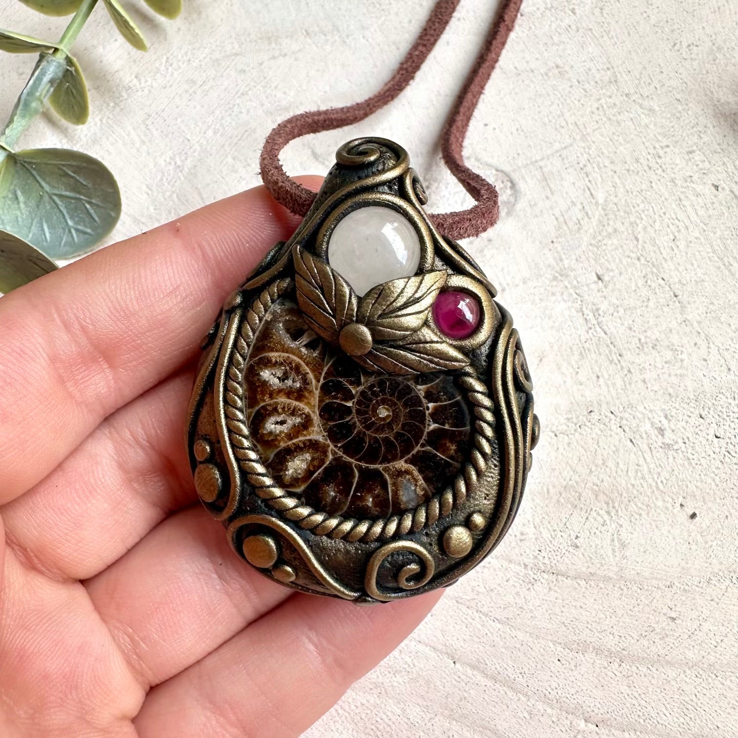 Spiritual jewelry necklace handcrafted with healing crystals for witches, healers, and fantasy jewelry lovers.
