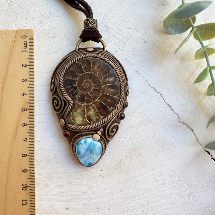 Large fossil pendant necklace with Larimar and garnet details