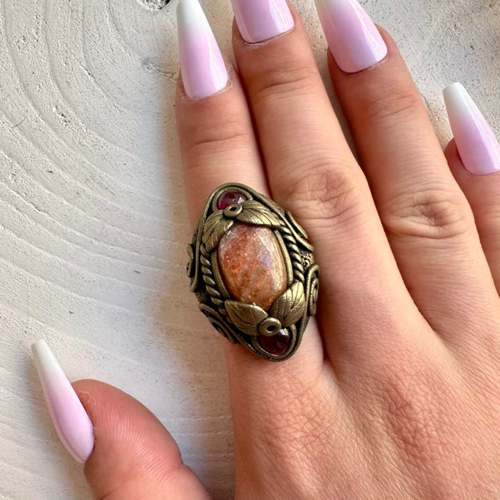 Handmade ring featuring Sunstone and Rhodolite Garnet natural gemstones.