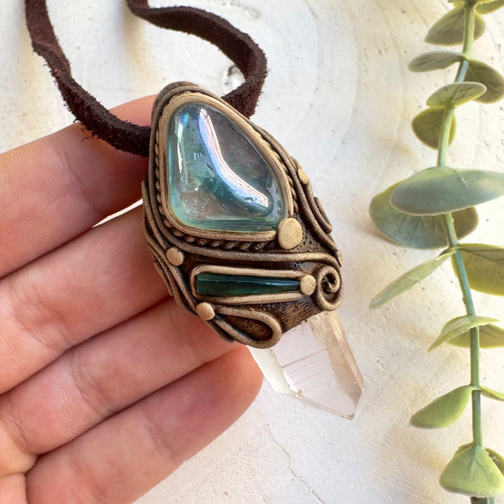 Metaphysical jewelry with Blue Tourmaline and Lemurian Quartz crystals