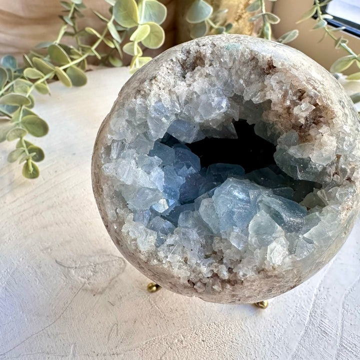 Celestite sphere with natural blue crystal formations