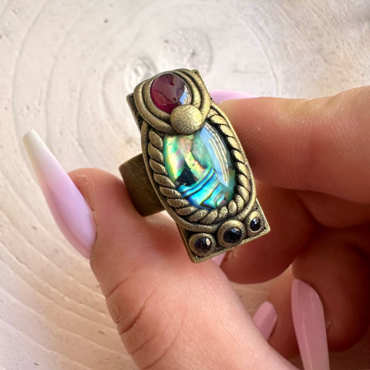 Abalone Seashell with Rhodolite Garnet and Blue Sapphire ring handcrafted as unique gemstone jewelry.