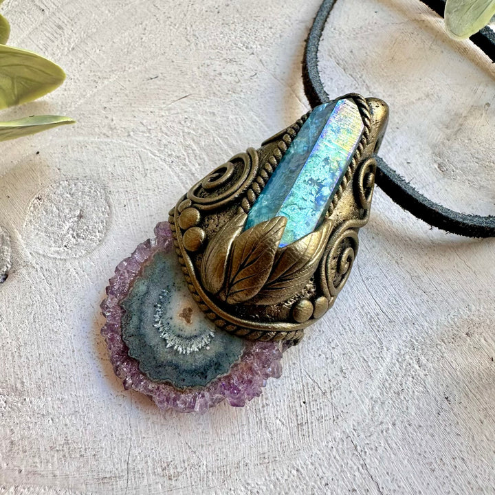 Handmade crystal jewelry with Amethyst Stalactite and Aqua Aura Quartz in a unique clay setting.