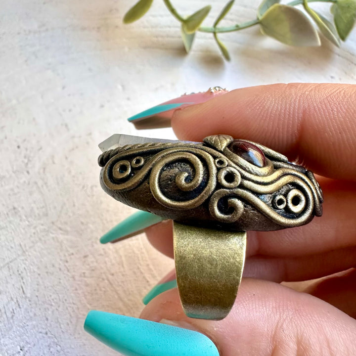 Spiritual jewelry ring combining opal and garnet crystals