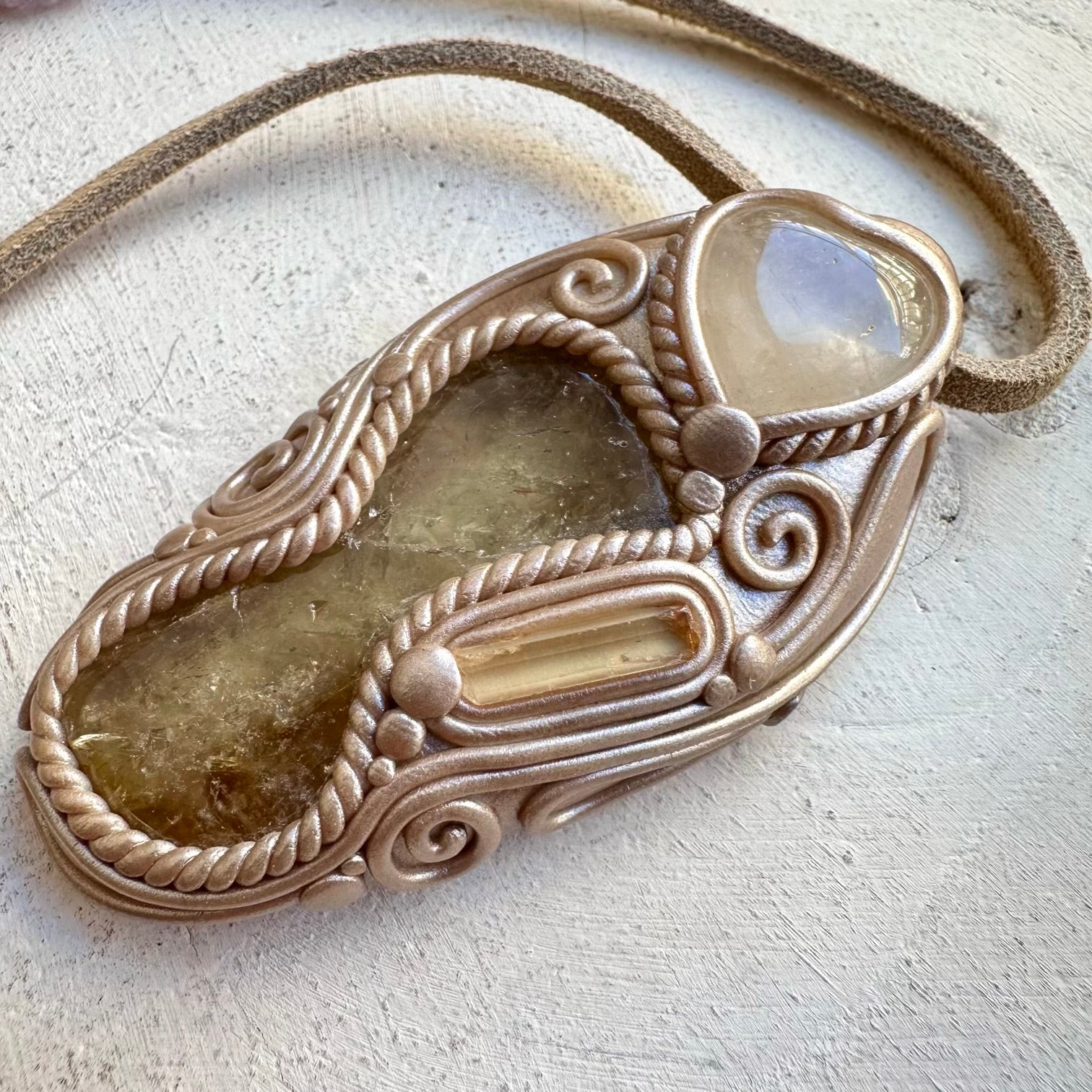 Polished citrine paired with clear quartz heart and topaz
