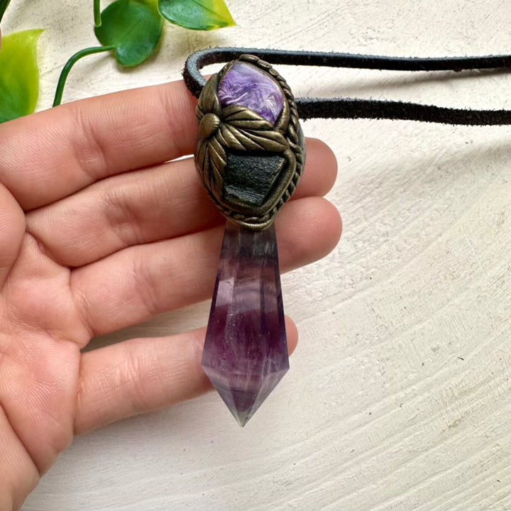 Artisan spiritual necklace featuring Fluorite, Charoite and Moldavite