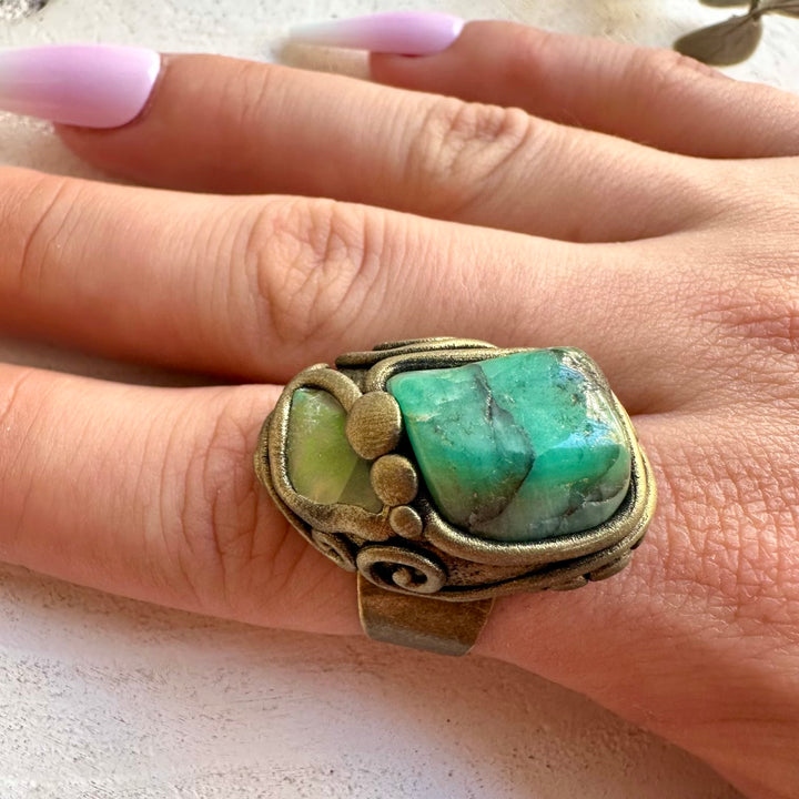 Unique gemstone jewelry with vibrant green Emerald and naturally colorful Ethiopian Opal.