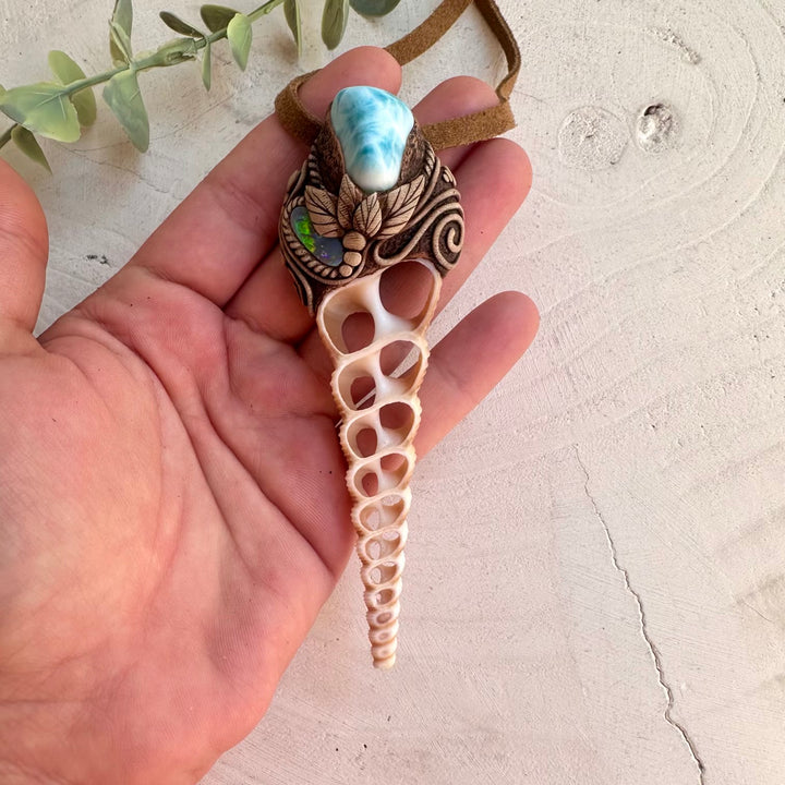 Unique handcrafted seashell jewelry with blue Larimar gemstone
