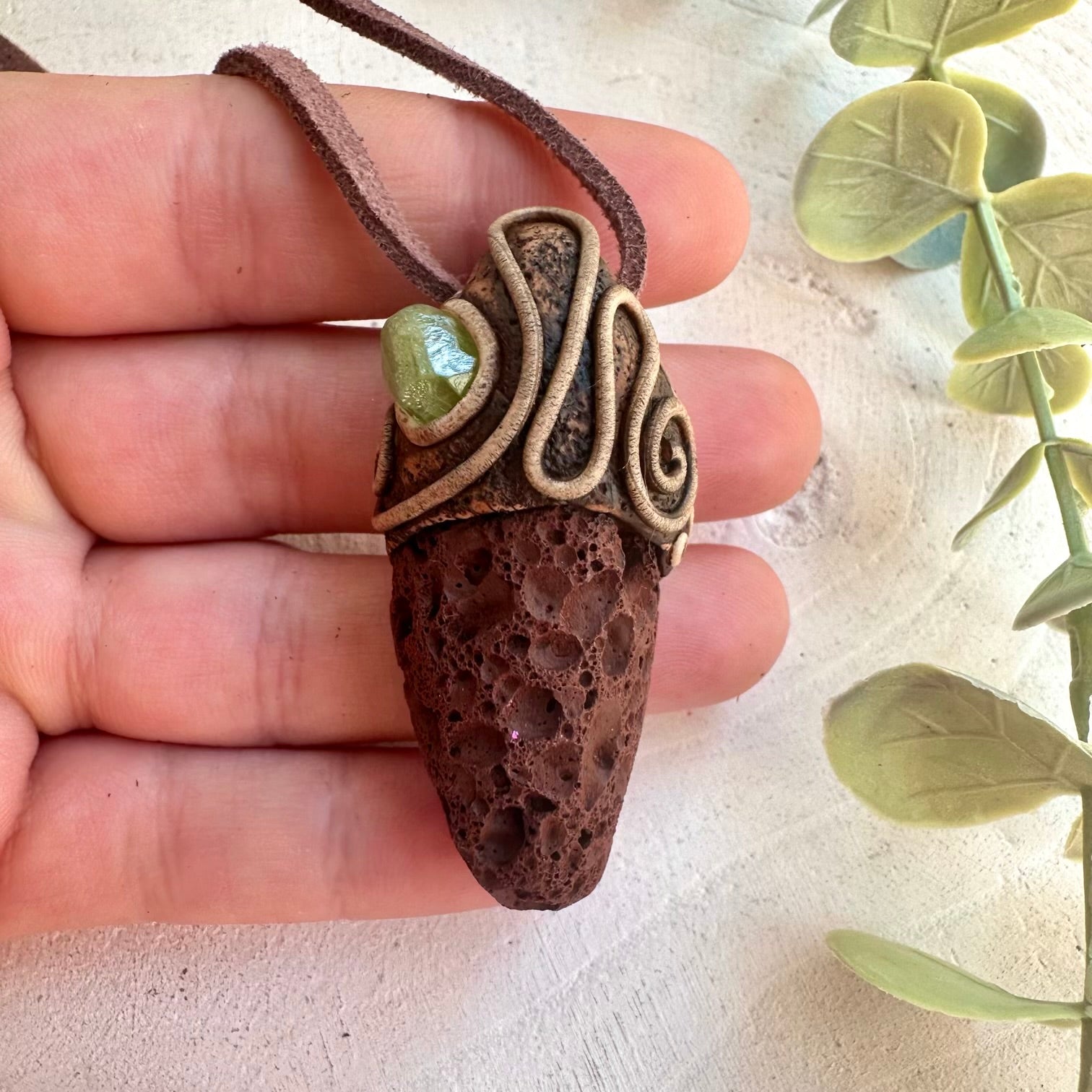 Metaphysical jewelry featuring volcanic Lava Stone and green Peridot