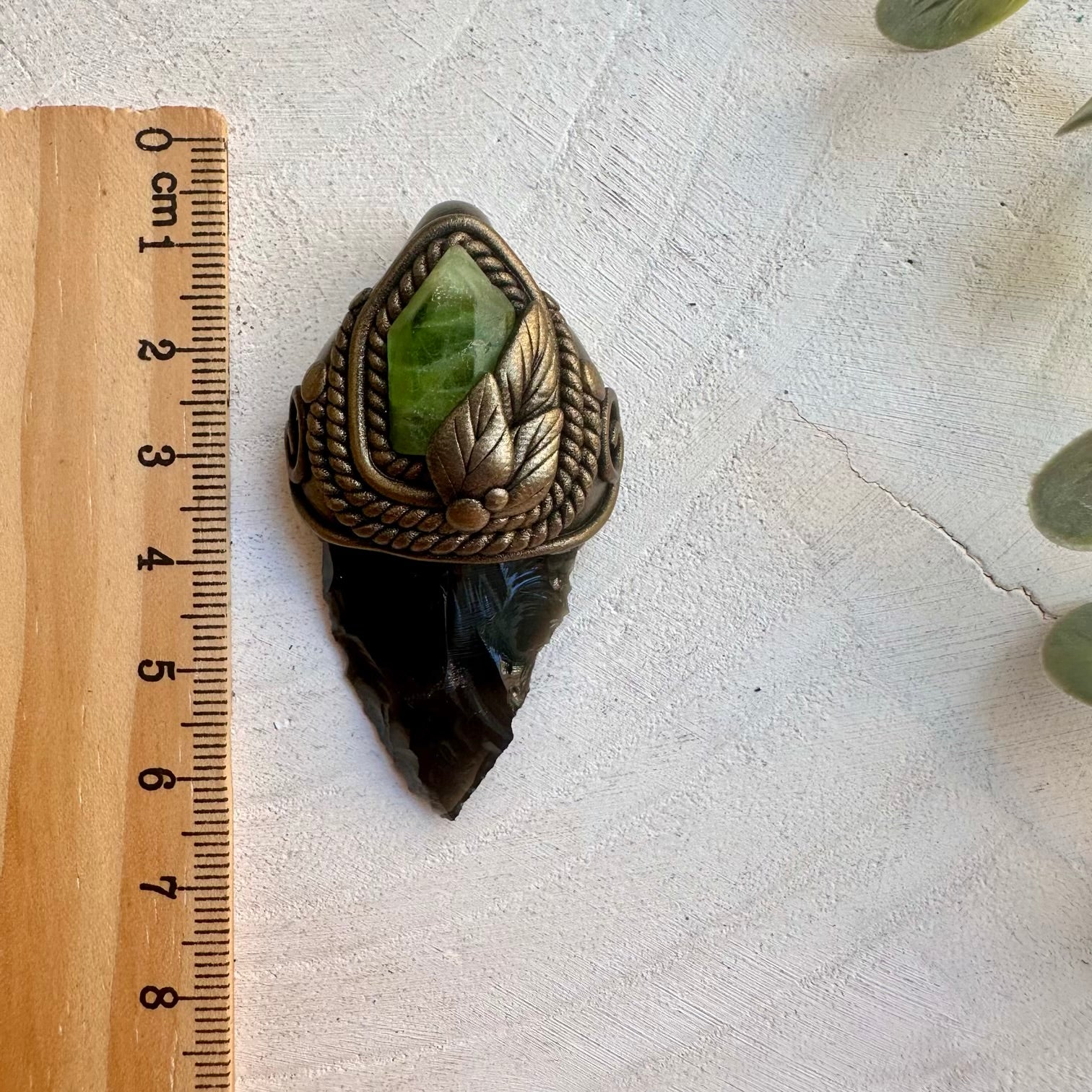 Spiritual jewelry combining peridot and black obsidian for rituals