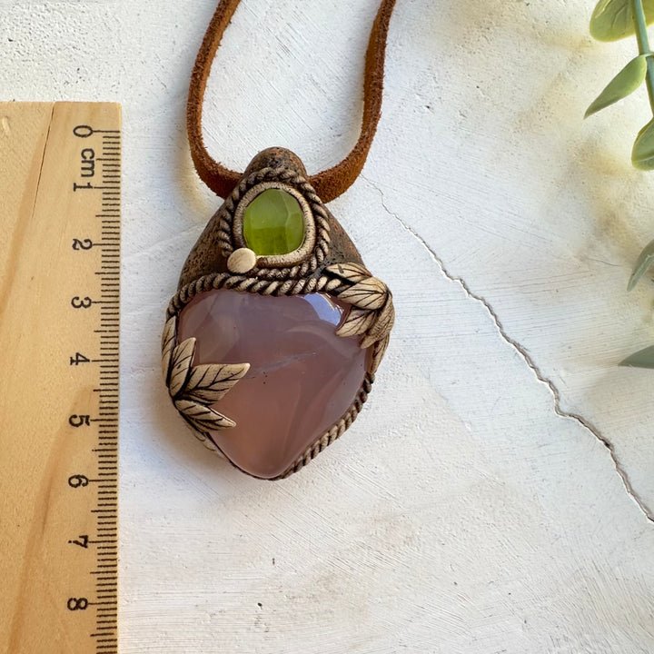 Natural pink chalcedony pendant with peridot accent stone